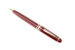 A MONTBLANC BURGUNDY PROPELLING PENCIL