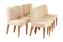 A SET OF EIGHT UPHOLSTERED DINING CHAIRS