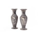 A PAIR OF BLACK MARBLE BALUSTER VASES