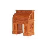 A THAI CARVED TEAK ROLL-TOP DESK