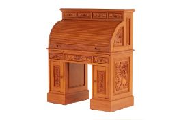 A THAI CARVED TEAK ROLL-TOP DESK