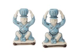 A PAIR OF CHINESE PORCELAIN FIGURAL CANDLESTICKS