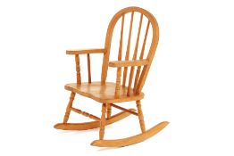 A CHILD'S OAK ROCKING CHAIR