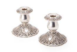 A PAIR OF AMERICAN SILVER PLATED CANDLESTICKS
