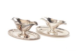 TWO SILVER PLATED DOUBLE LIPPED SAUCEBOATS AND STANDS