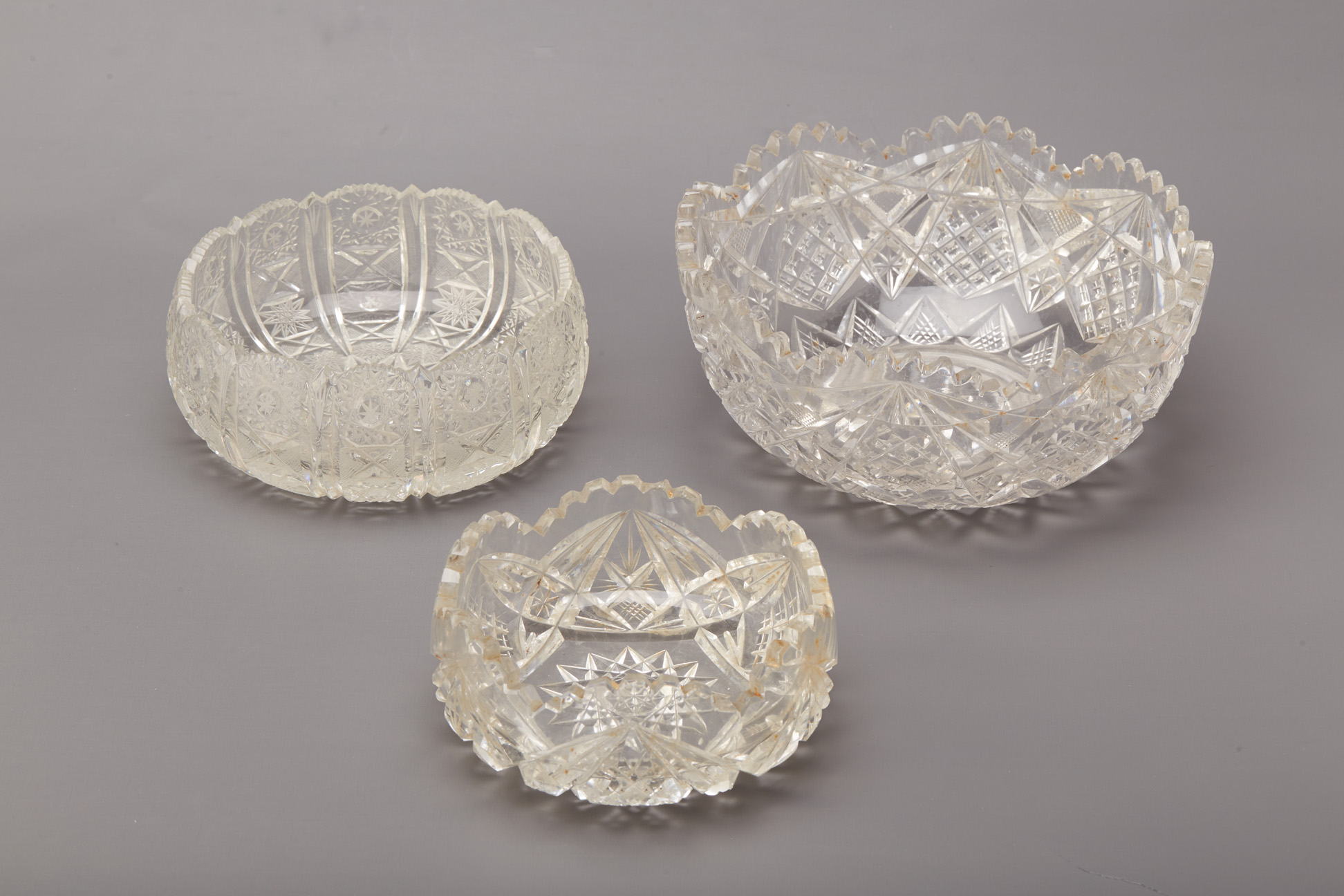 A GROUP OF THREE CUT GLASS BOWLS