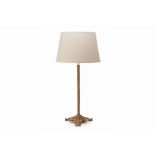 A BRASS TABLE LAMP WITH GREY SHADE