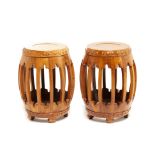 A PAIR OF WOODEN BARREL FORM DRUM STOOLS