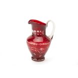 A RUBY FLASHED AND CUT GLASS WATER JUG