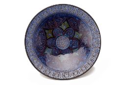A MOROCCAN BLUE GLAZED POTTERY CHARGER