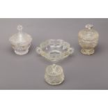A GROUP OF FOUR CUT AND MOULDED GLASS JARS AND BOWLS