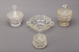 A GROUP OF FOUR CUT AND MOULDED GLASS JARS AND BOWLS