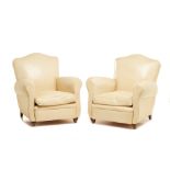 A PAIR OF CREAM LEATHER CLUB ARMCHAIRS