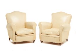 A PAIR OF CREAM LEATHER CLUB ARMCHAIRS