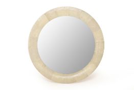 A LARGE CIRCULAR SHAGREEN MIRROR