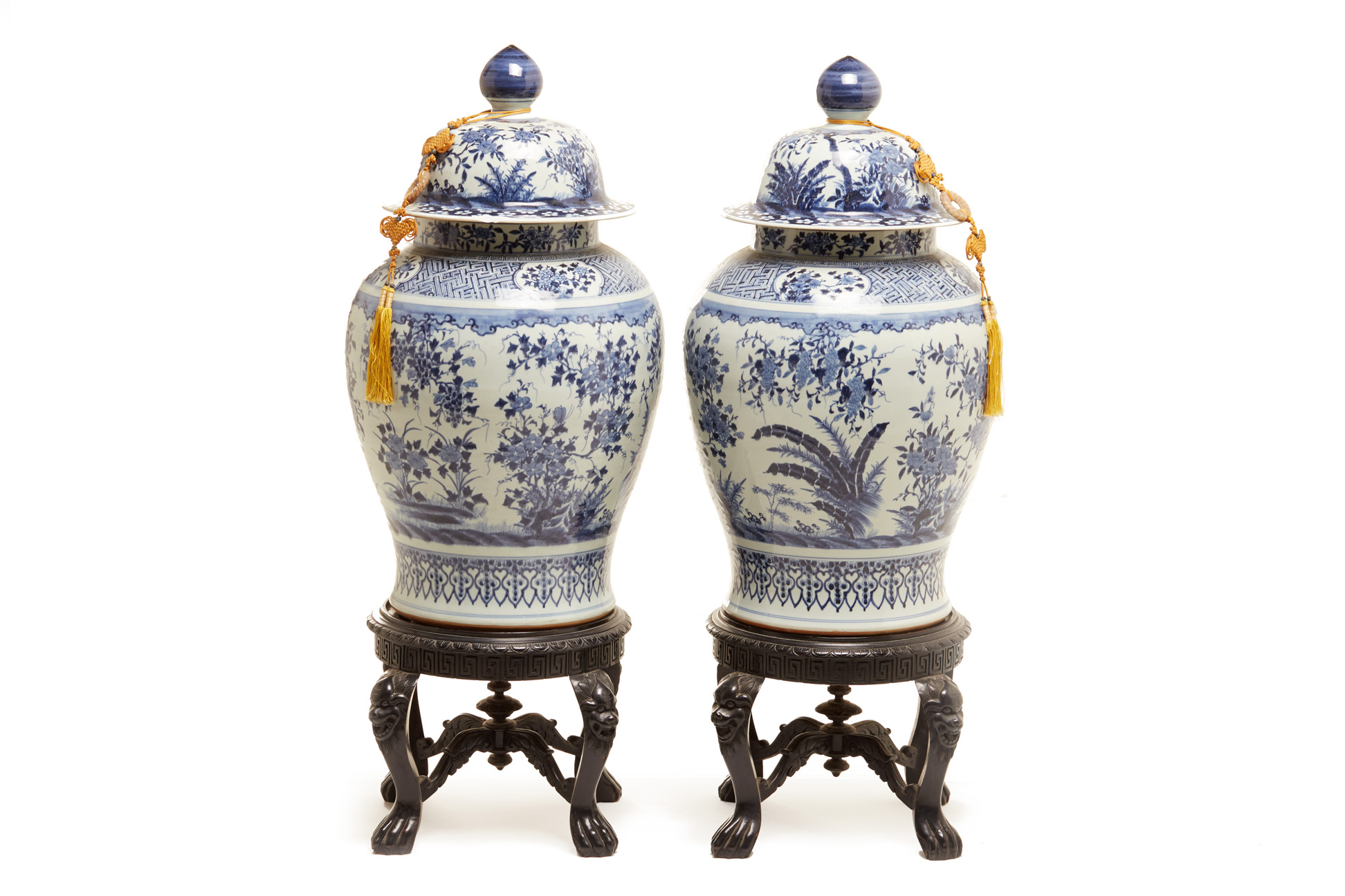 A PAIR OF LARGE BLUE & WHITE JARS AND COVERS ON STAND