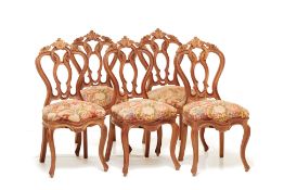 A SET OF FIVE ANTIQUE CARVED DINING CHAIRS