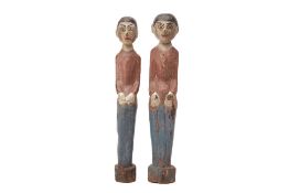 A PAIR OF INDONESIAN TRIBAL CARVED WOOD FIGURES