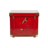 A JAPANESE RED LACQUER CHEST DECORATED WITH CRANES