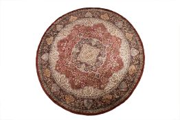 A LARGE SILK PERSIAN STYLE CIRCULAR CARPET