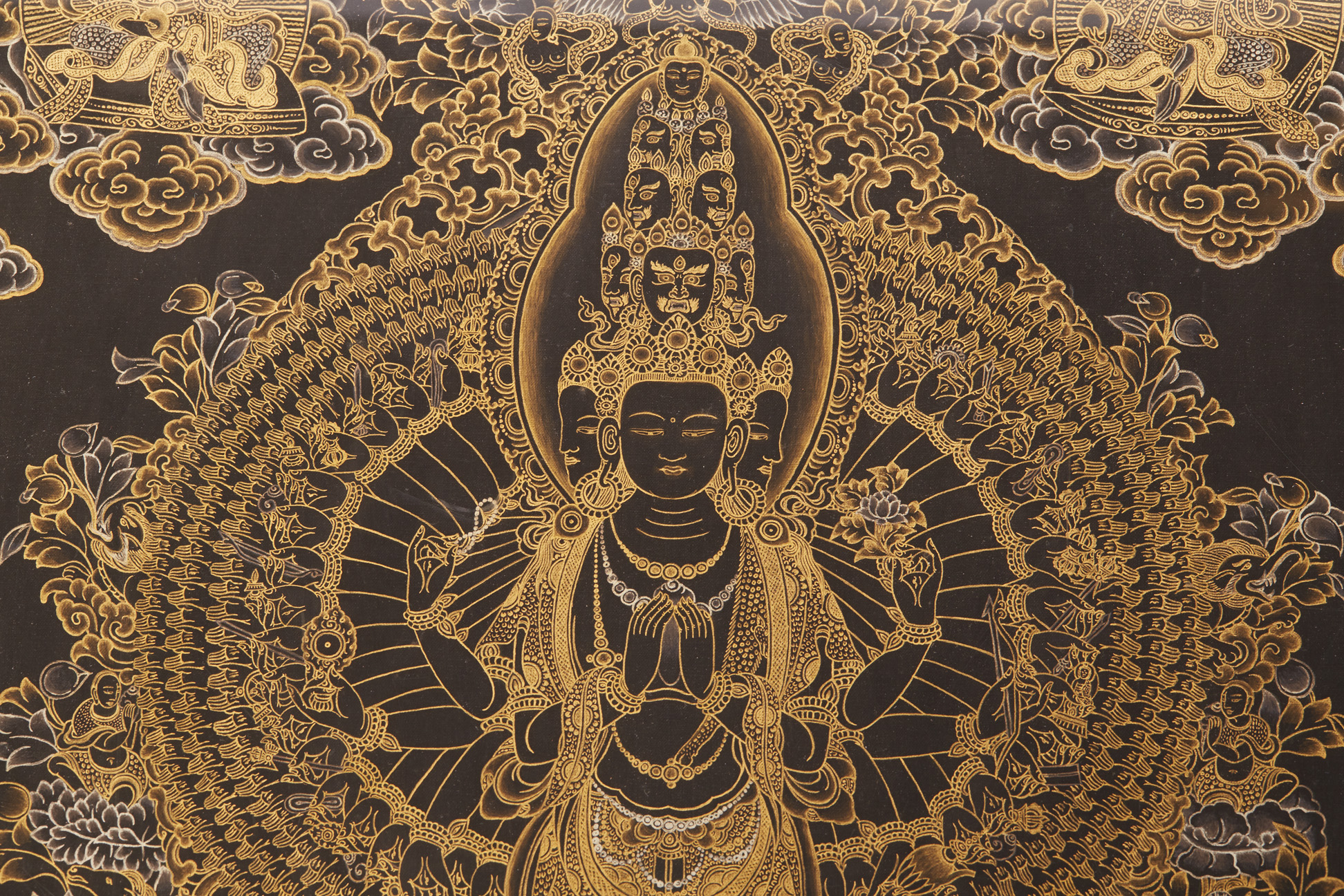 A BLACK AND GILT PAINTED THANGKA - Image 2 of 2