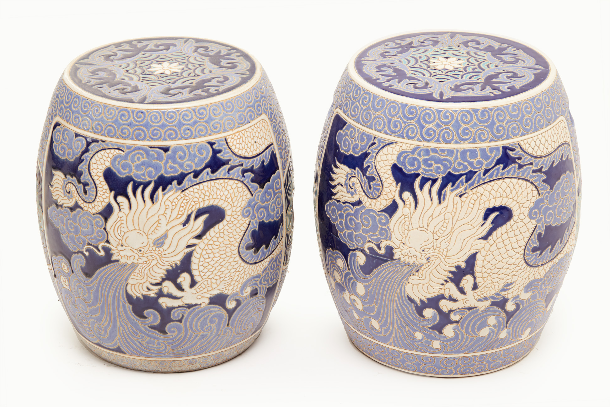 A PAIR OF BLUE AND WHITE BARREL FORM STOOLS