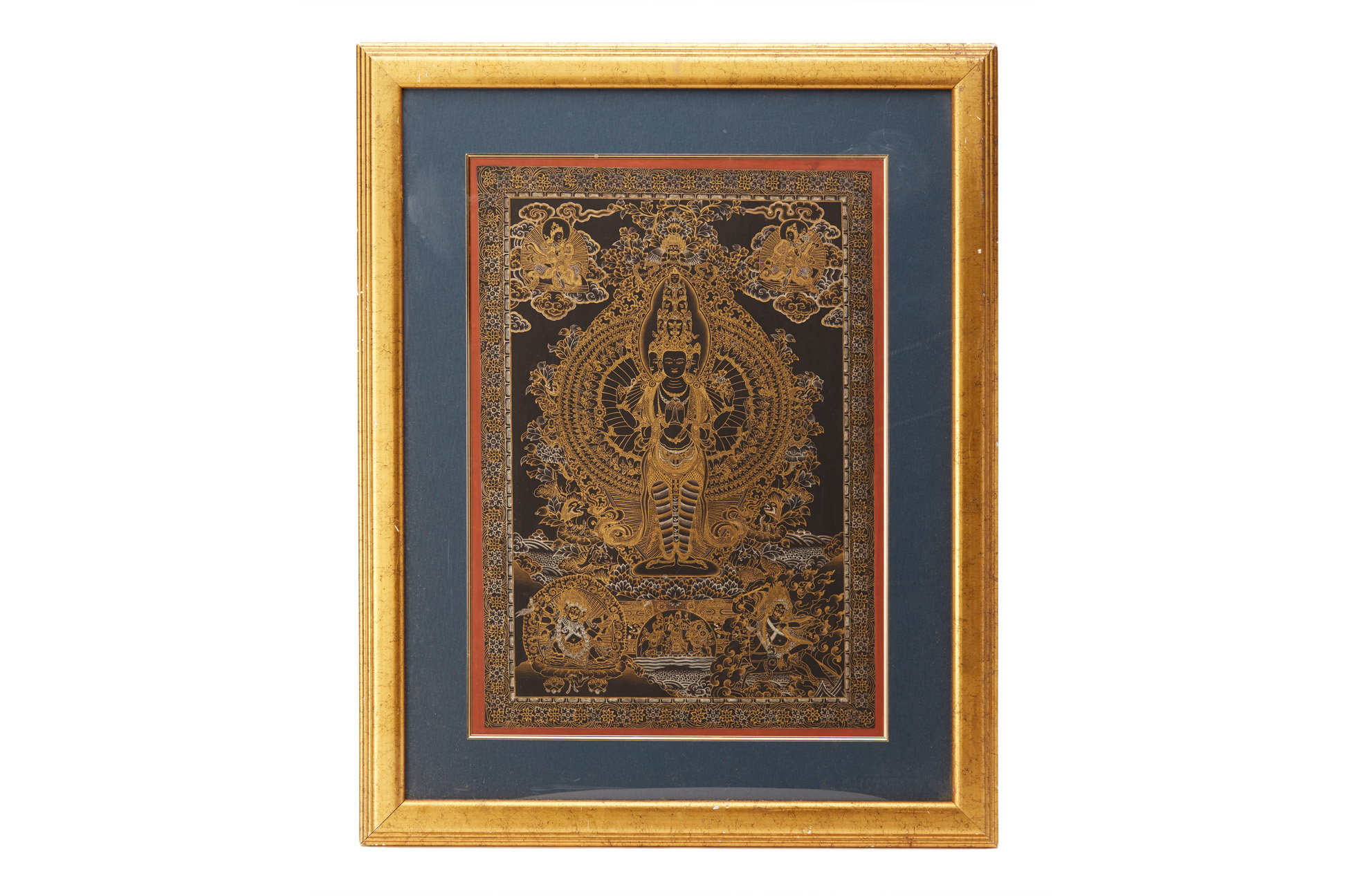 A BLACK AND GILT PAINTED THANGKA