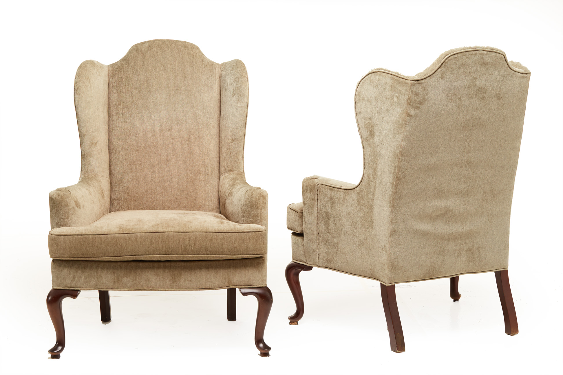 A PAIR OF VELVET UPHOLSTERED ARMCHAIRS