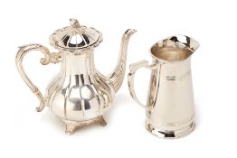 A STAINLESS STEEL COFFEE POT AND A WATER JUG