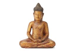 A SOUTHEAST ASIAN CARVED GILT WOOD BUDDHA