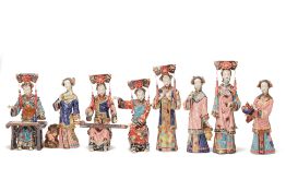 A GROUP OF EIGHT CHINESE POTTERY FIGURES OF LADIES