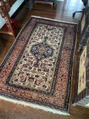 AN ORIENTAL RUG