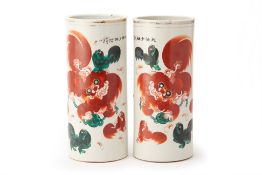 A PAIR OF IRON RED LION CYLINDER VASES