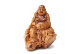 A CARVED BURL WOOD FIGURE OF BUDAI