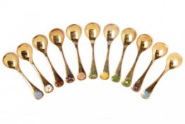 A SET OF 11 GEORG JENSEN SILVER GILT CHRISTMAS SPOONS