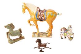 A GROUP OF FOUR VARIOUS MODELS OF HORSES