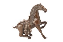 A PATINATED BRONZE MODEL OF A HORSE
