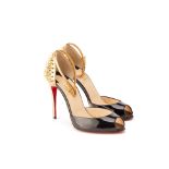 A PAIR OF CHRISTIAN LOUBOUTIN BLACK & GOLD HEELS EU 36