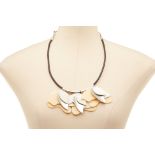 A CREAM COLOURED SHELL FLOWER NECKLACE