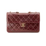 A CHANEL VINTAGE OX BLOOD DOUBLE FLAP BAG