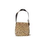 A CHRISTIAN DIOR QUILTED CHEETAH PRINT CANVAS HANDBAG