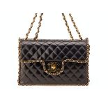 A VINTAGE CHANEL BLACK MAXI FLAP BAG WITH CHAIN TRIM