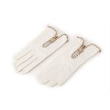 A PAIR OF VERSACE WHITE LEATHER GLOVES