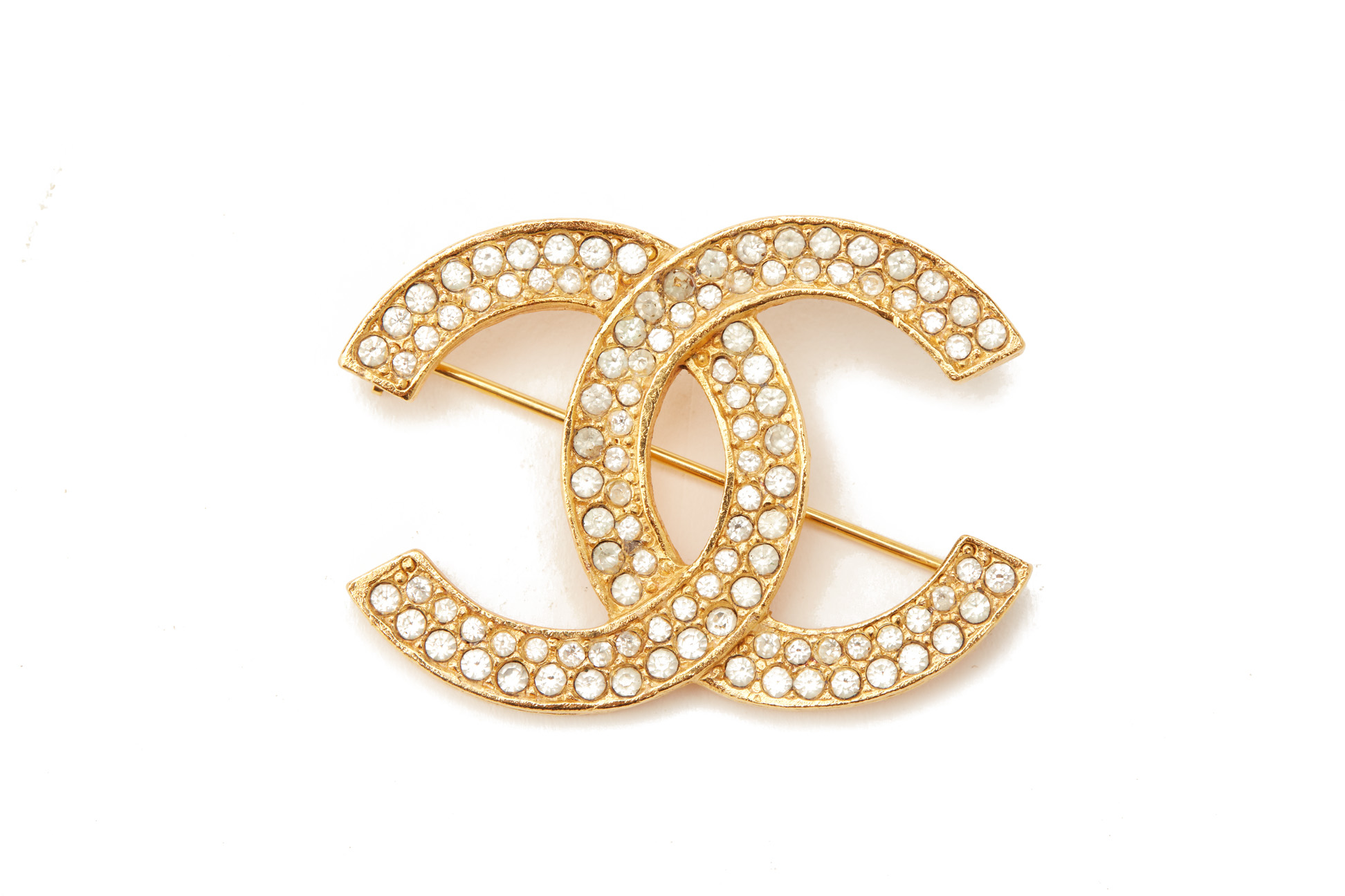 A CHANEL GILT METAL AND PASTE SET BROOCH