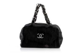 A CHANEL FUR BLACK HANDBAG