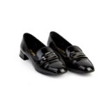 A PAIR OF PRADA BLACK PATENT LOAFERS EU36