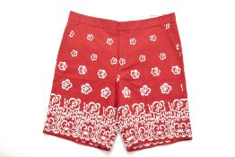 A PAIR OF MIU MIU RED EMBROIDERED SHORTS