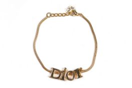 A CHRISTIAN DIOR GOLD-TONE BRACELET