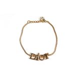 A CHRISTIAN DIOR GOLD-TONE BRACELET