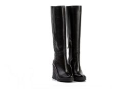 A PAIR OF PRADA BLACK LEATHER WEDGE BOOTS EU36